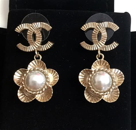 chanel earrings cc gold pearl|chanel cc earrings real.